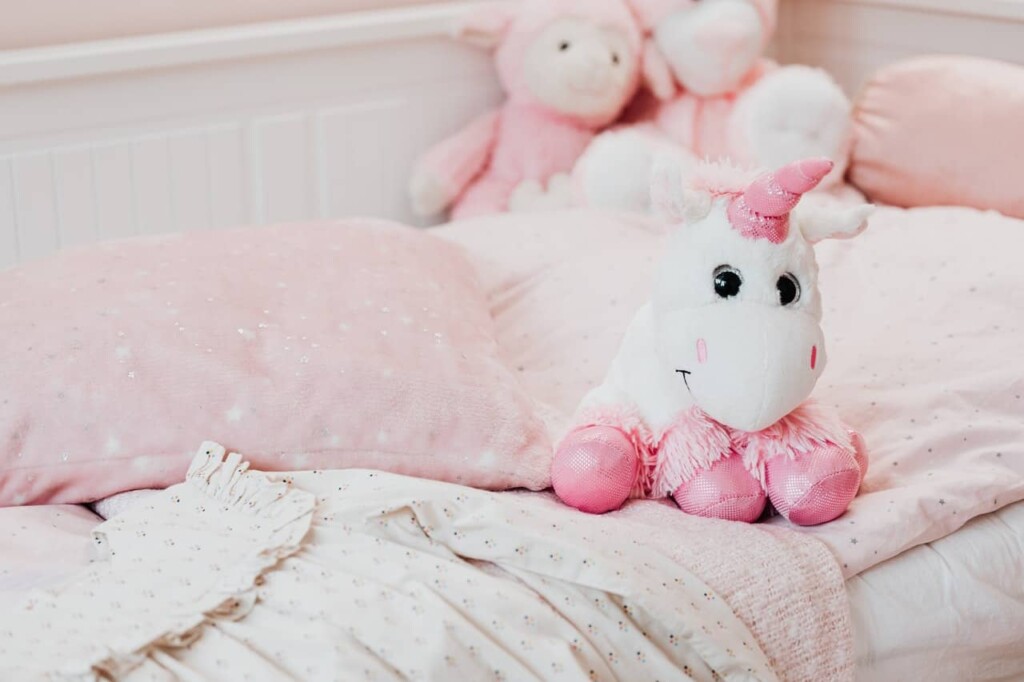 baby blanket and stuffed animal unicorn